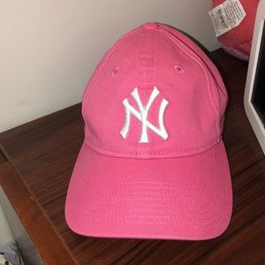 Yankees baseball cap.